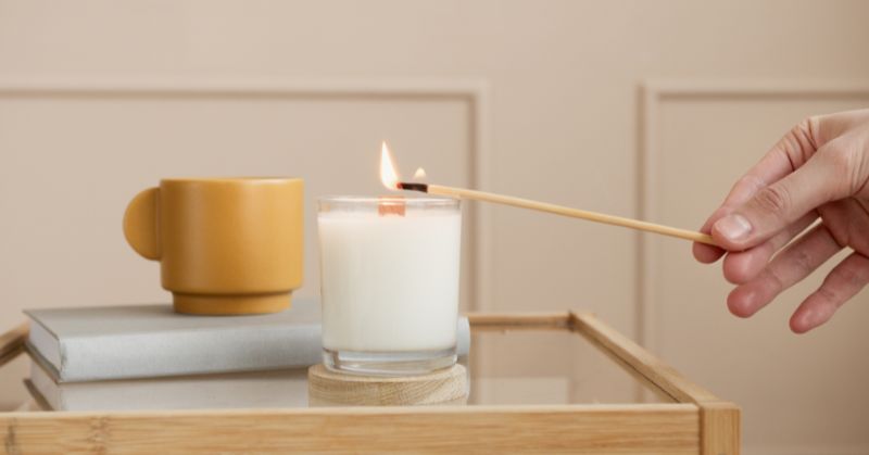 A candle with a flame in a glass AI-generated content may be incorrect.
